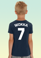 The back of a boy wearing a navy blue children’s t-shirt showing bold white number 7 hand-printed across the shoulders, representing RAF 7 Squadron.