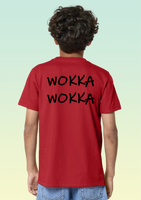 The back of a boy wearing a red t-shirt with black “WOKKA WOKKA” text printed across the shoulders. 