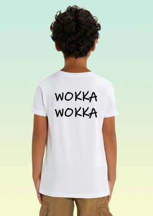 The back of a boy wearing a white t-shirt with bold black print reading “WOKKA WOKKA” across the upper back.