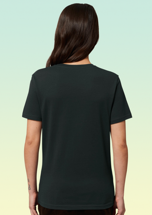 The back view of a woman wearing a black t-shirt with no print or design -clean and minimal.