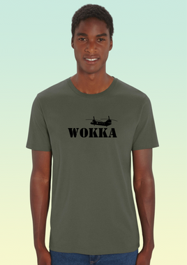 A man wearing a khaki heavyweight cotton t-shirt with black print of a stylised Chinook helicopter above bold text WOKKA.
