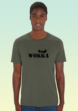 A man wearing a khaki heavyweight cotton t-shirt with black print of a stylised Chinook helicopter above bold text WOKKA.