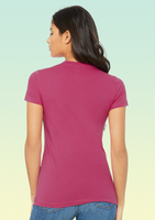 The back view of a woman wearing a plain pink t-shirt with no print or design.