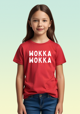 A girl wearing a red cotton children's t-shirt with bright white screen printed WOKKA WOKKA text across the front.