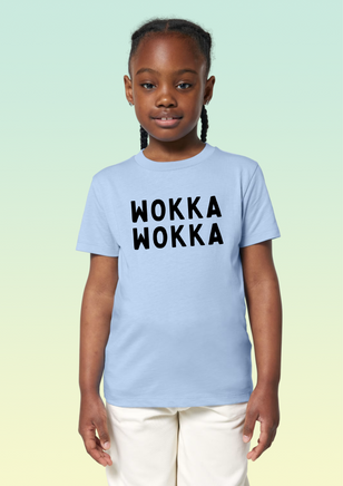 A girl wearing a sky blue cotton t-shirt with the text WOKKA WOKKA in bold black print across the front.
