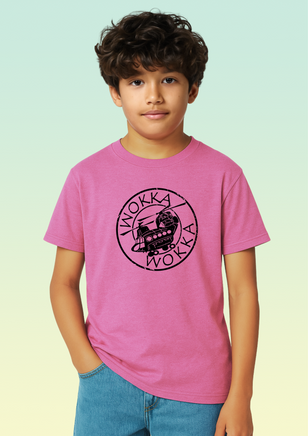 A boy wearing a pink cotton children’s t-shirt with black circular Chinook helicopter print on the front.