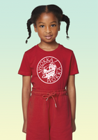 A girl wearing a red cotton children’s t-shirt with white stylised Chinook helicopter design in a circular front print.