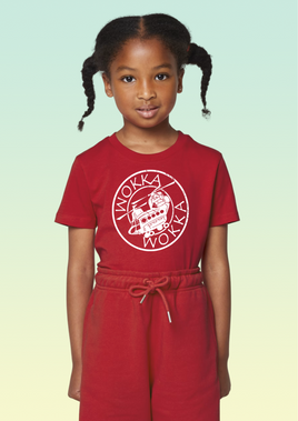 A girl wearing a red cotton children’s t-shirt with white stylised Chinook helicopter design in a circular front print.